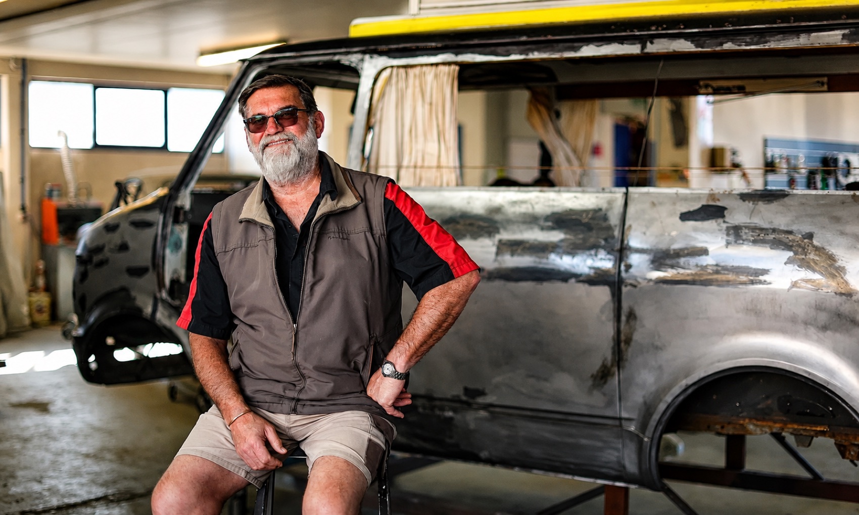 Craftsman restoring a bare metal classic body at the Geraldine Auto Restorations workshop