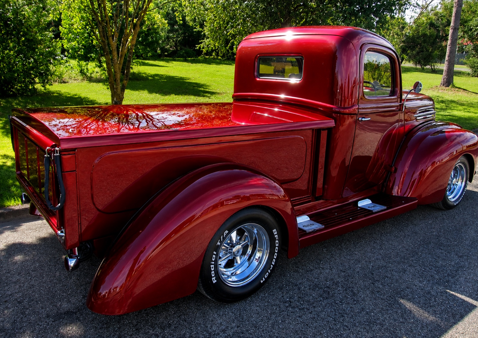 Custom candy red pickup restored and painted in the Geraldine workshop