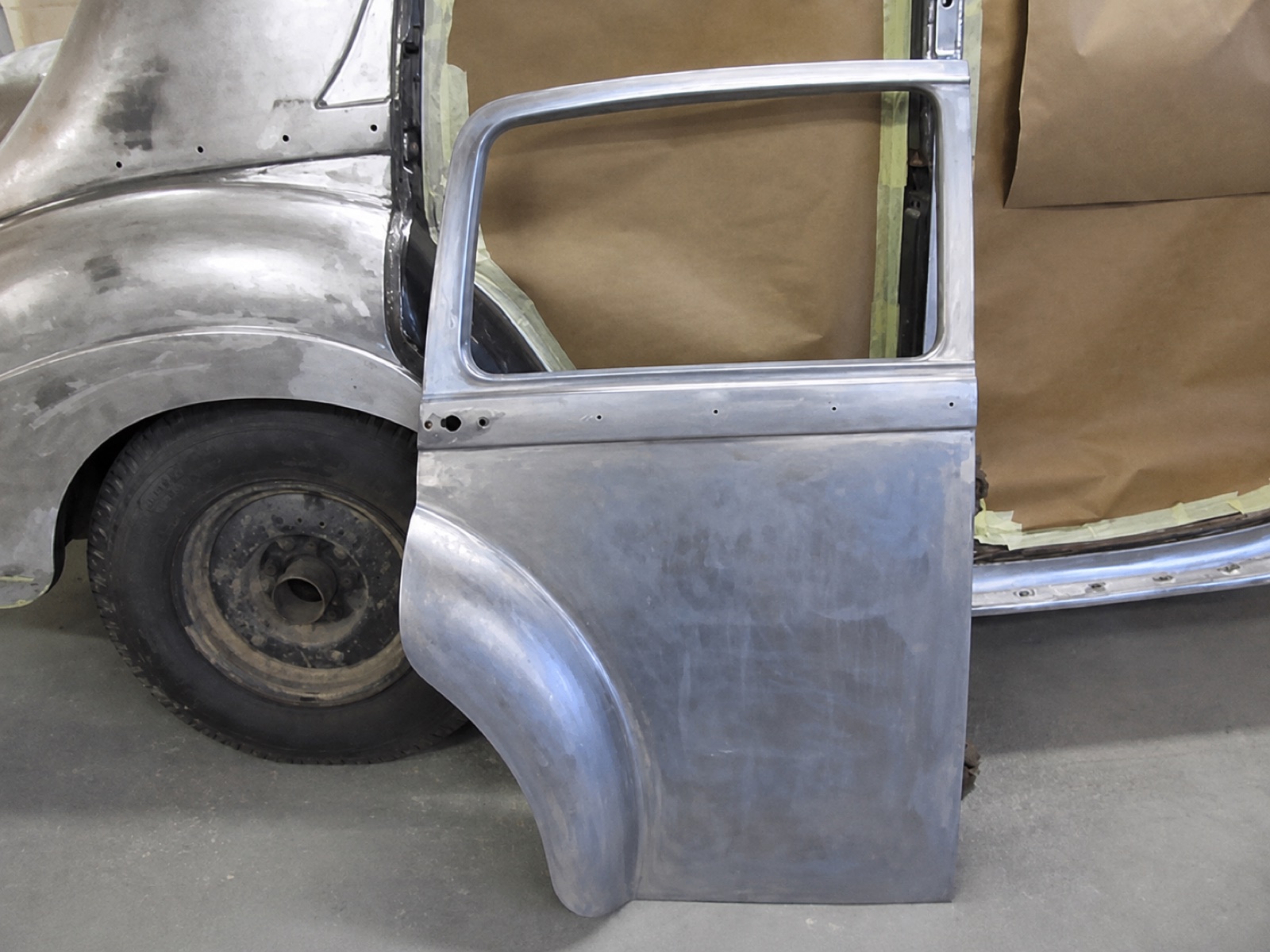 Panel and body repair on a classic car in primer