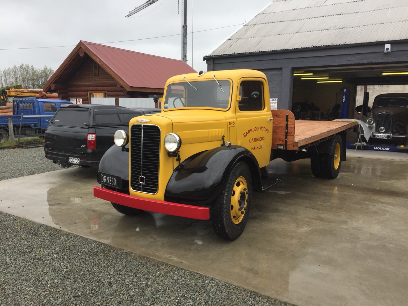 The restored Bedford flatbed truck finished in yellow and black
